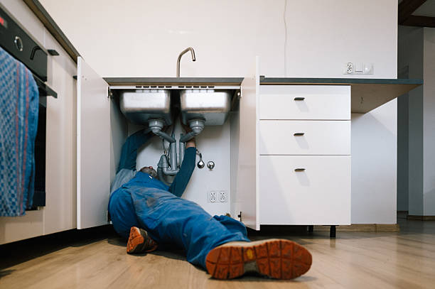 Professional Emergency Plumber technician working in Tiffin, IA